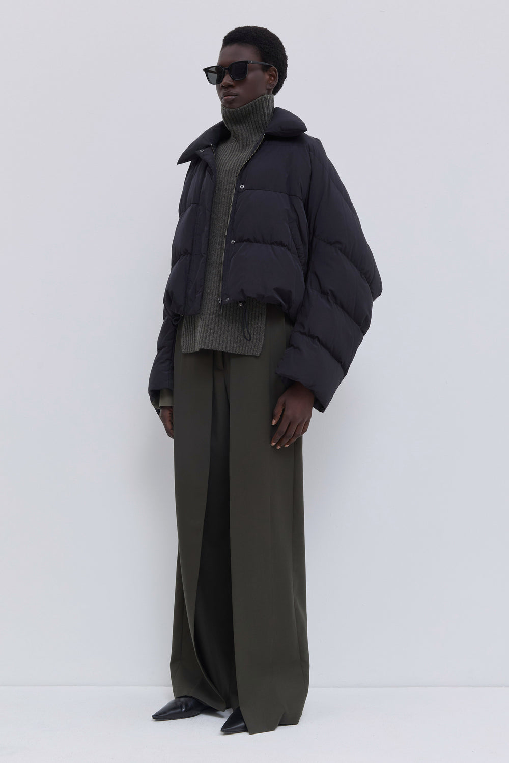 Front view of the Jani oversized down jacket with statement collar.