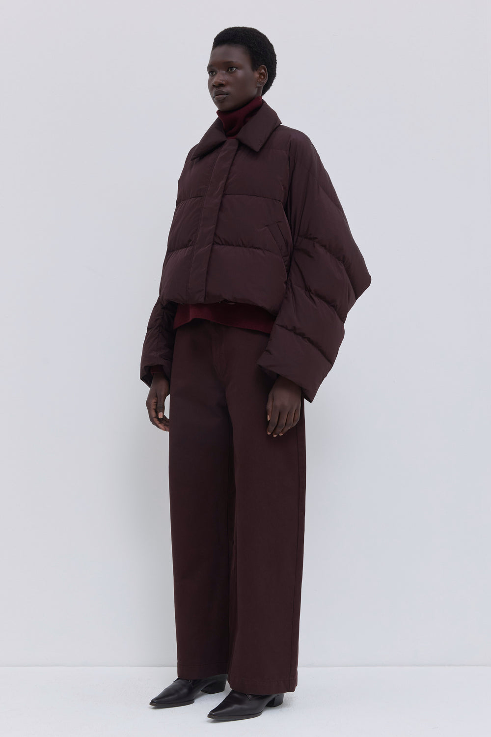 Back view of the Jani signature down jacket in plum.