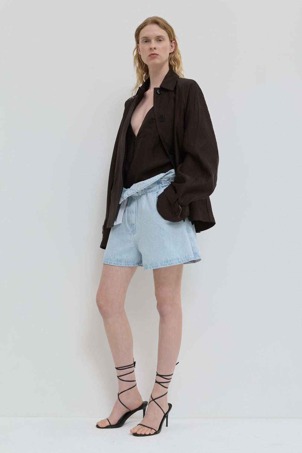 Chocolate quilted jacket with belted cuffs and relaxed fit