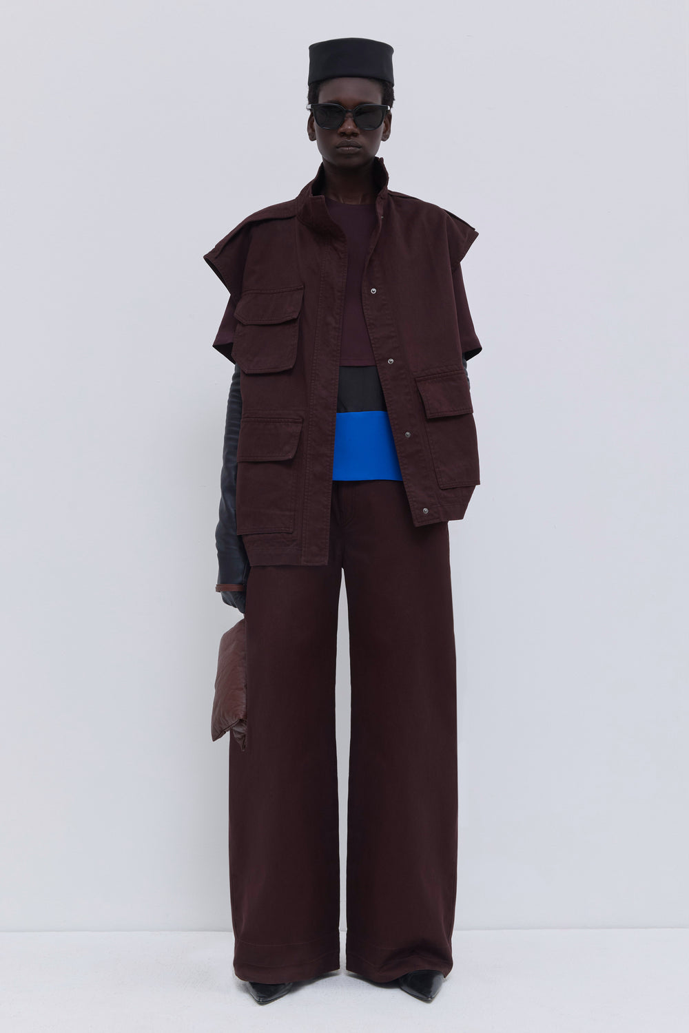 Christian Wijnants Jupi sleeveless jacket in plum garment-dyed organic cotton with utility pockets and high collar.