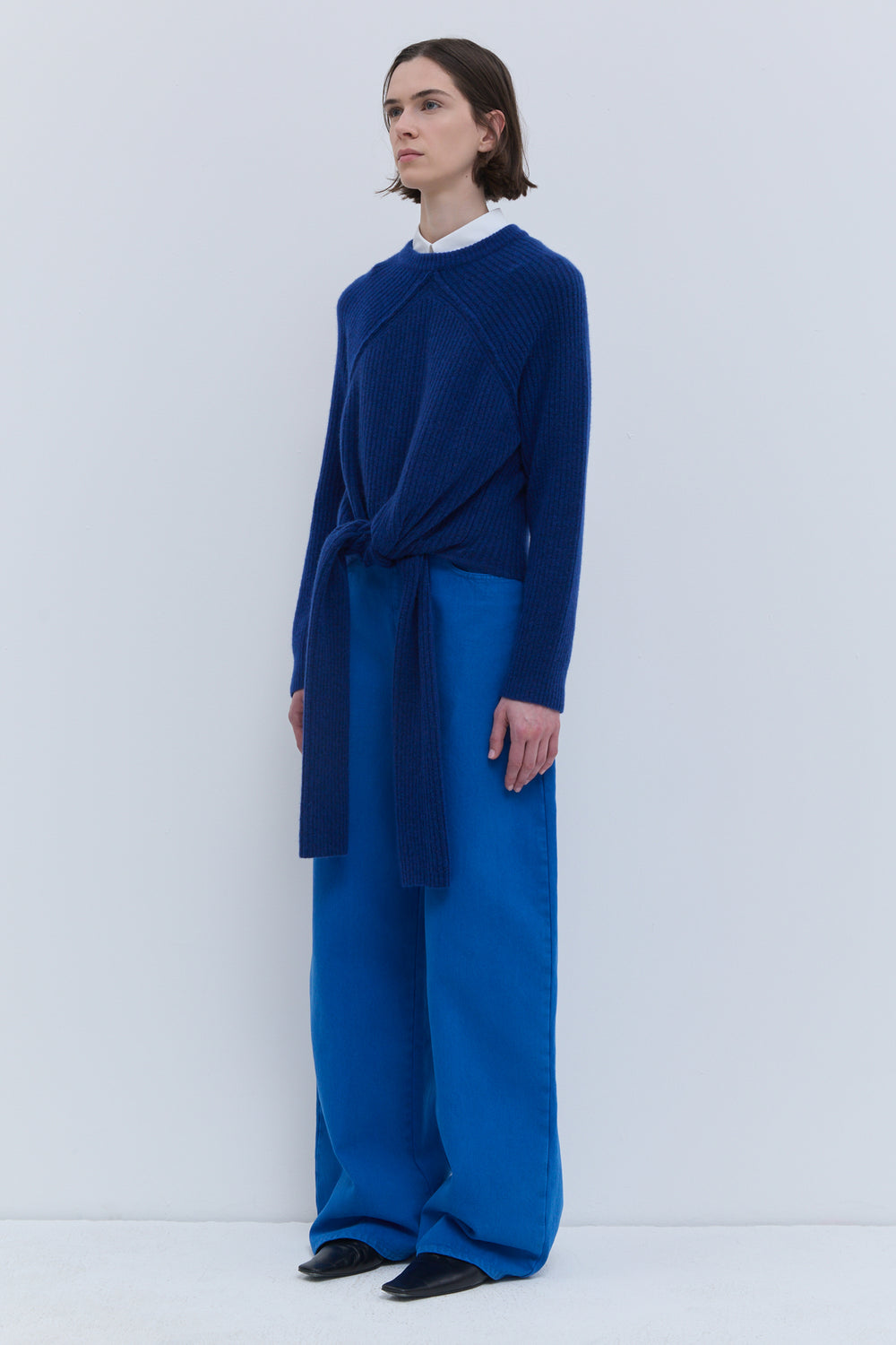 Deep blue sweater with long front ties