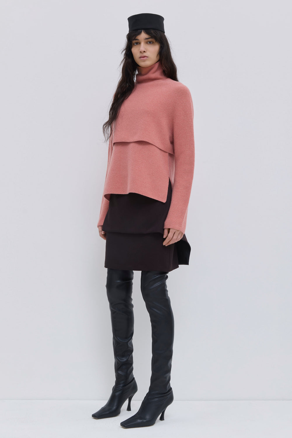 Coral wholegarment wool sweater with cropped silhouette and layered look
