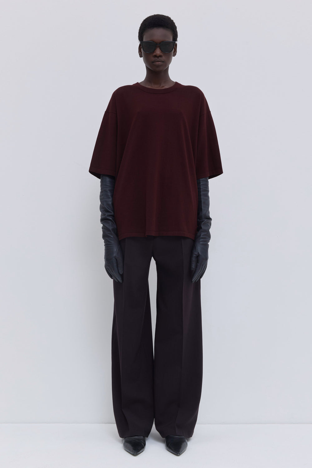 Plum oversized cotton T-shirt with dropped shoulders and back strap detail.