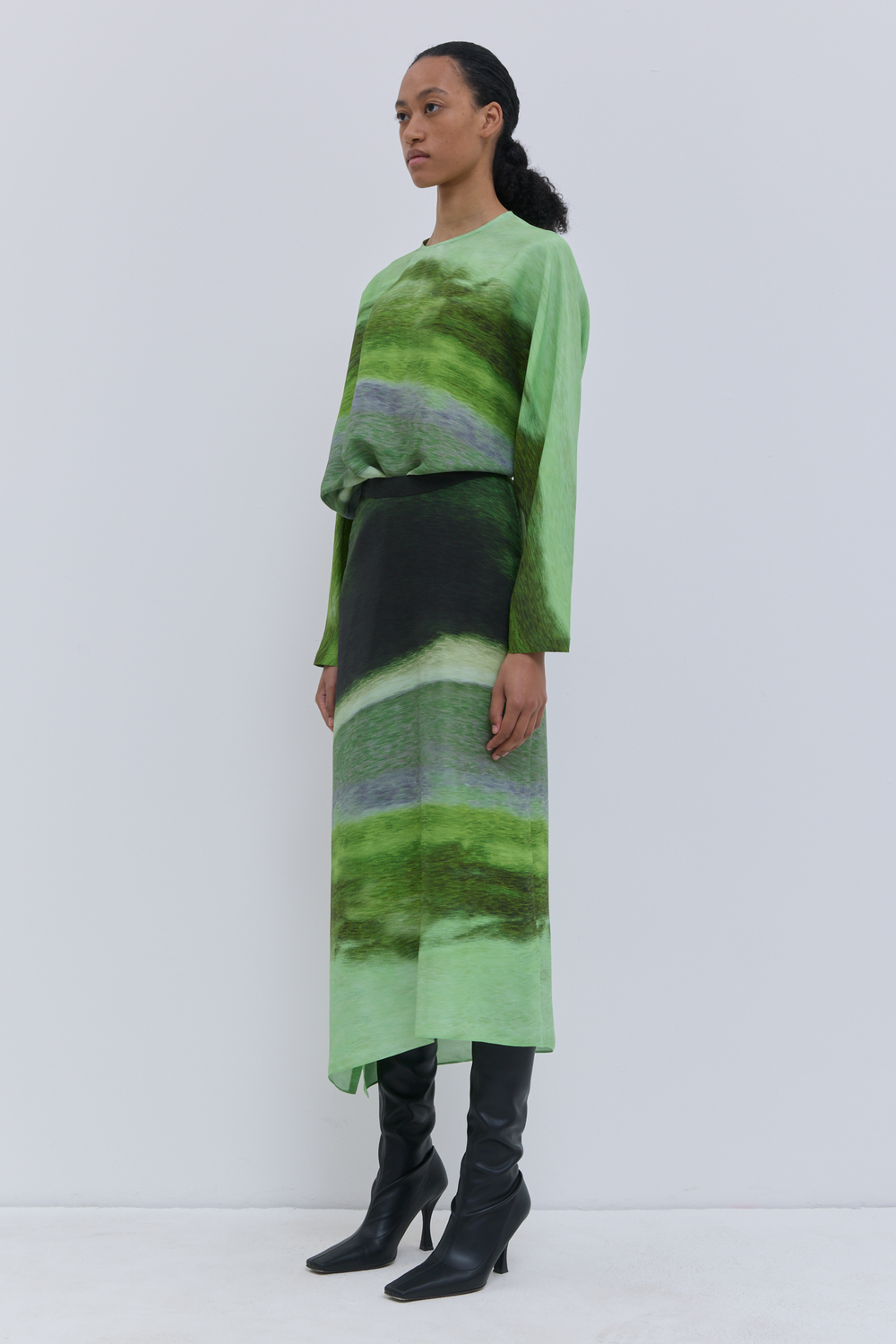Sueza printed silk skirt styled with a matching green top
