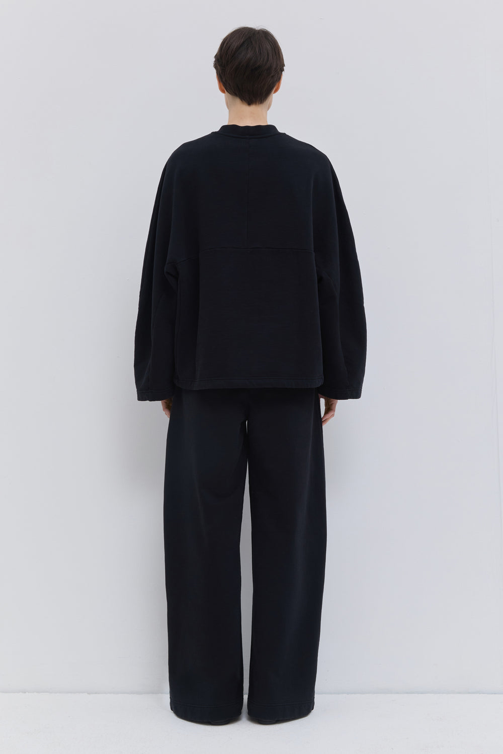 Relaxed-fit black crew neck sweatshirt in garment-dyed jersey.
