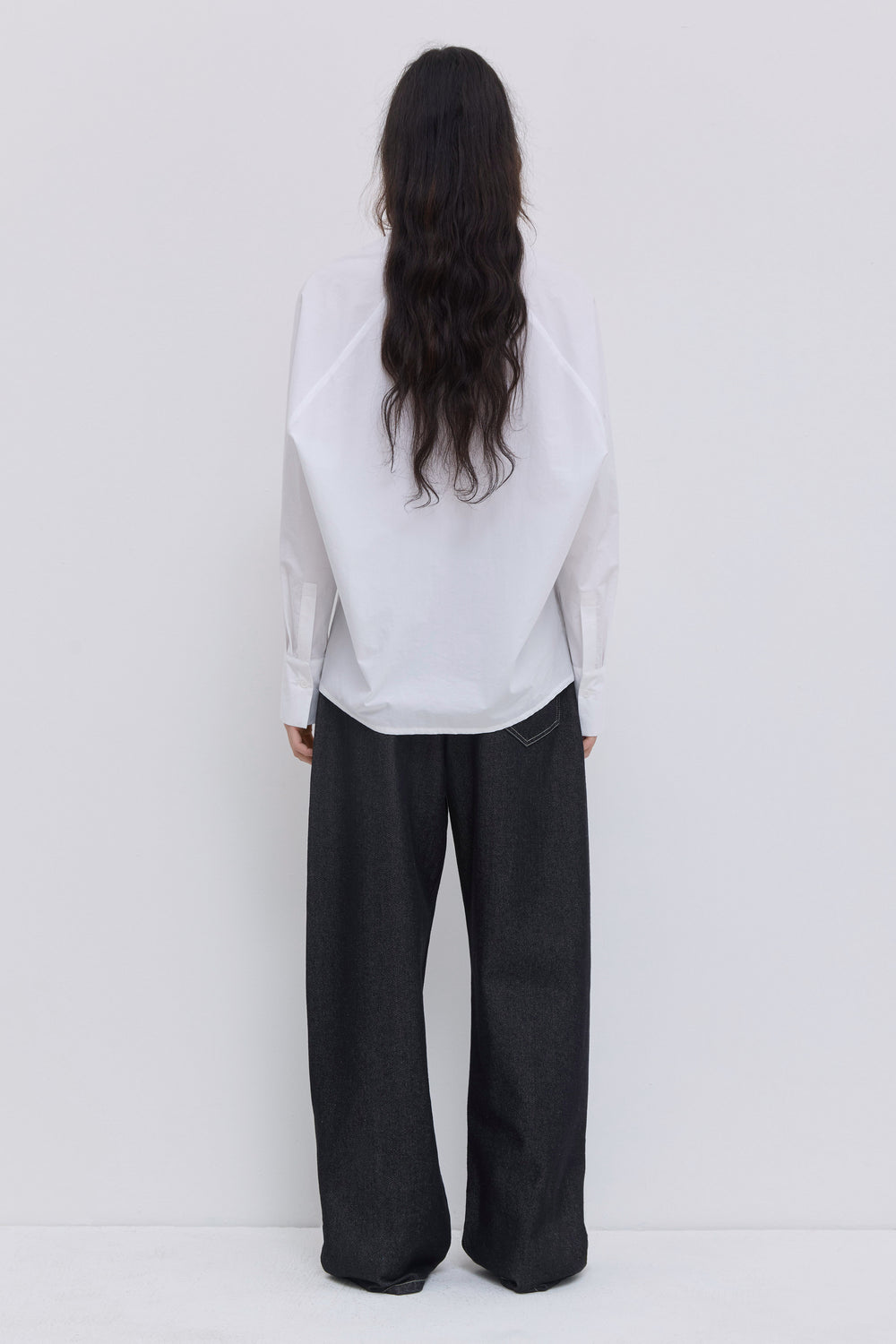 White batwing sleeve blouse in organic Japanese cotton featuring a fluid shape and clean minimalist design by Christian Wijnants.